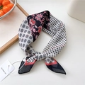 Polka dot and floral silk scarf with red accent, styled in a bow for fashion accessory - Four Grid Floral Polka Dot Black