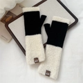 Detail of color-block knit fingerless gloves with fluffy faux fur cuffs and leather tag - Black