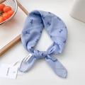 Light blue cotton linen hair scarf with navy bow pattern and chic brand tag - Polka Dot Bow Blue