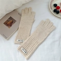 Detail of cream knit gloves featuring fingerless design and branded woven label - Off White
