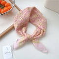 Pink floral cotton linen scarf tied in a knot featuring a delicate yellow flower pattern - Simple Leaf Egg Flower Pink