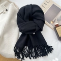 Close-up of black wool blend knitted scarf featuring dense long tassels and soft texture - 39*190cm / Black