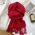 Close-up of red 100% wool scarf with fringe detail on a soft white fabric background - 39*190cm / Red