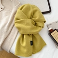 Close-up of ginger yellow 100% wool knitted scarf with soft texture and brand label - Black Label Wide Scarf (MX0288) / 34*167cm / Yellow