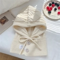 Detail of cream knit balaclava showing soft texture buttons and adjustable drawstring - One Size / Creamy White
