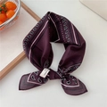 Dark purple paisley cotton bandana tied in a bow on a clean white aesthetic background - Wine Red Border Paisley