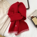 Detail of red wool blend knit scarf featuring striped hem and elegant metal buckle - Red