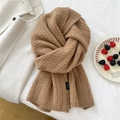 Close-up of 100% wool camel knit scarf featuring premium cable knit texture and softness - 30x172cm / Camel
