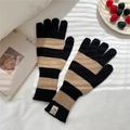 Detail of striped knitted gloves with extended ribbed cuffs and woven brand tag - Black & Camel Gloves (Single)