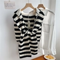Detail of black and white striped knit shawl draped over a classic white shirt - Black & White Stripes