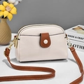 Chic beige lychee grain shoulder bag with brown trim and gold hardware in a set scene - White & Yellow Patchwork