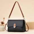 Minimalist black square crossbody bag with brown leather strap and gold accent buckle - Black