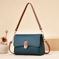 Minimalist navy blue litchi pattern flap bag with brown strap and gold hardware - Blue
