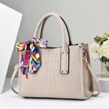 Elegant beige crocodile pattern handbag with colorful silk scarf and gold studs - Off White
