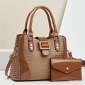 Detail of caramel brown croc-embossed tote bag and matching envelope wallet set - Khaki