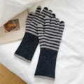Detail of grey striped knitted long gloves on white fabric with cozy aesthetic decor - Black / Gray Stripe