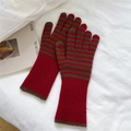 Detail of striped knit gloves featuring red ribbed cuffs and warm thermal texture - Red/Brown Stripes