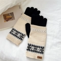 Detail of knitted winter gloves featuring ethnic patterns and a stitched leather brand label - Off White