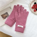 Detail of knitted pink cashmere gloves with wide wavy ribbed cuffs on a white fabric - One Size / Pink (9WOOL)