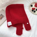 Detail of red knit balaclava scarf featuring a white pearl button and logo label - Red