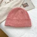 Detail of pink marl knit beanie showing soft textured fabric with colorful fiber flecks - 100% Wool Speckled Pink