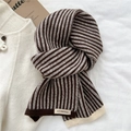 Brown and white striped knit scarf featuring a branded woven label for autumn style - Brown