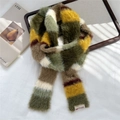 Close-up of colorful striped plush scarf with soft texture and brand logo label - Narrow Striped Plush (3DD) / Green
