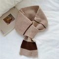 Detailed view of the thick striped knit scarf with cream and brown texture and care label - Beige Coffee