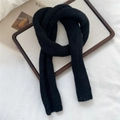 Detail of soft black knit scarf texture showing thick yarn weave on a lifestyle background - 14*110cm / Black