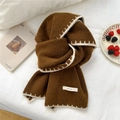 Dark brown chunky knit scarf with white stitched edge on a cozy white bed setting - 30x165cm / Yellow Oak