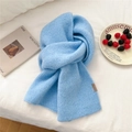 Sky blue knitted mohair scarf with leather tag detail in a cozy winter setting - Leather Label Style / 23*167cm / Blue
