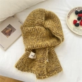 Knitted ginger and brown scarf hat combo with fuzzy texture on white bedsheet background - Striped Yellow