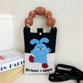 Detail of knitted mini crossbody bag featuring a cartoon rabbit and brown bubble handle - Brown Handle Blue Rabbit Style