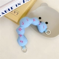 Close-up of light blue quilted bag strap with pink embroidery and white spring rings - Blue