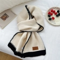 Chunky knit cream scarf with black wavy edges and a decorative brown leather patch - Milk White (Leather Label)