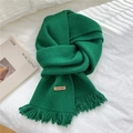 Handmade emerald green knit scarf with tassels and leather label on white fabric - Dark Green