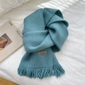 Teal knit winter scarf with soft fringe tassels and a leather Hand Made label - Blue