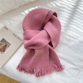 Dusty pink knitted scarf with thick fringes and a brown handmade leather label - Peach Pink