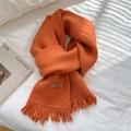 Bright orange knitted scarf for women with warm tassels and a handcrafted leather label - Orange