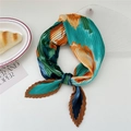 Pleated square scarf with abstract orange and lake blue patterns tied in a chic knot - Ocean Orange Flowers (Pleated 13)