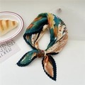 Pleated square scarf with green and orange floral print used as a decorative necktie - Ginkgo Maple Leaf Patchwork (Pleated 16)