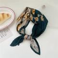 Pleated silk scarf with dark green floral and animal patterns in a stylish knot - Yellow Frangipani (Pleated 22)