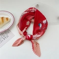 Red pleated square scarf with floral and bird patterns shown in a flat lay display - Red Sea Bird Magnolia (Pleated 26)
