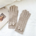 Close-up of oatmeal knitted gloves featuring a 3D bow detail and elastic ribbed cuffs - One Size / Beige Coffee