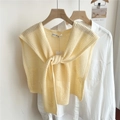 Close-up of a pale yellow knitted shawl with hollow floral patterns and tie front detail - 44*100cm / Hollow Arrow Fruit Tree Light Yellow