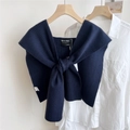 Close-up of navy blue ribbed knit shawl tied over a white shirt on wooden hanger - 42*105cm / Navy Blue