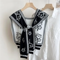 Detail of floral jacquard knit shawl with black and white stripes on a white shirt - Black (Small Flower)