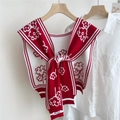 Close-up of red and white floral knitted shawl over a white shirt for women - Red (Small Flower)