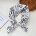 White cotton square scarf featuring a black paisley pattern and a knotted style - 14cotton-Paisley Pattern Beige