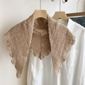 Handmade beige crochet triangle shawl with floral lace pattern on wooden hanger - Camel